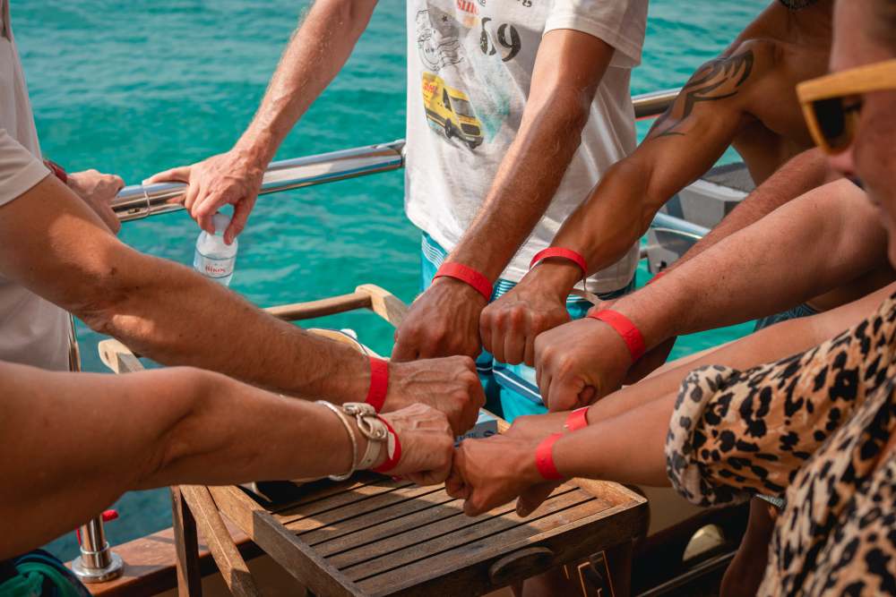 Friends cheering and playing games on private group cruise