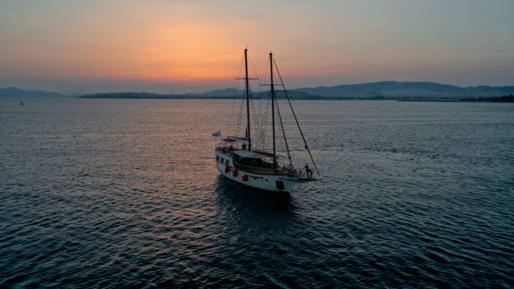 Group sunset cruise in Athenian reviera with 49 guests enjoying BBQ on board and greek menu