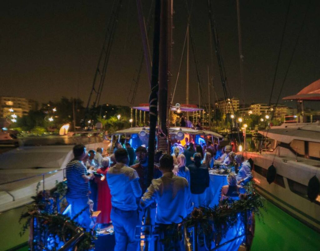 Corporate Cruises in Athens with Guests dancing and celebrating on deck